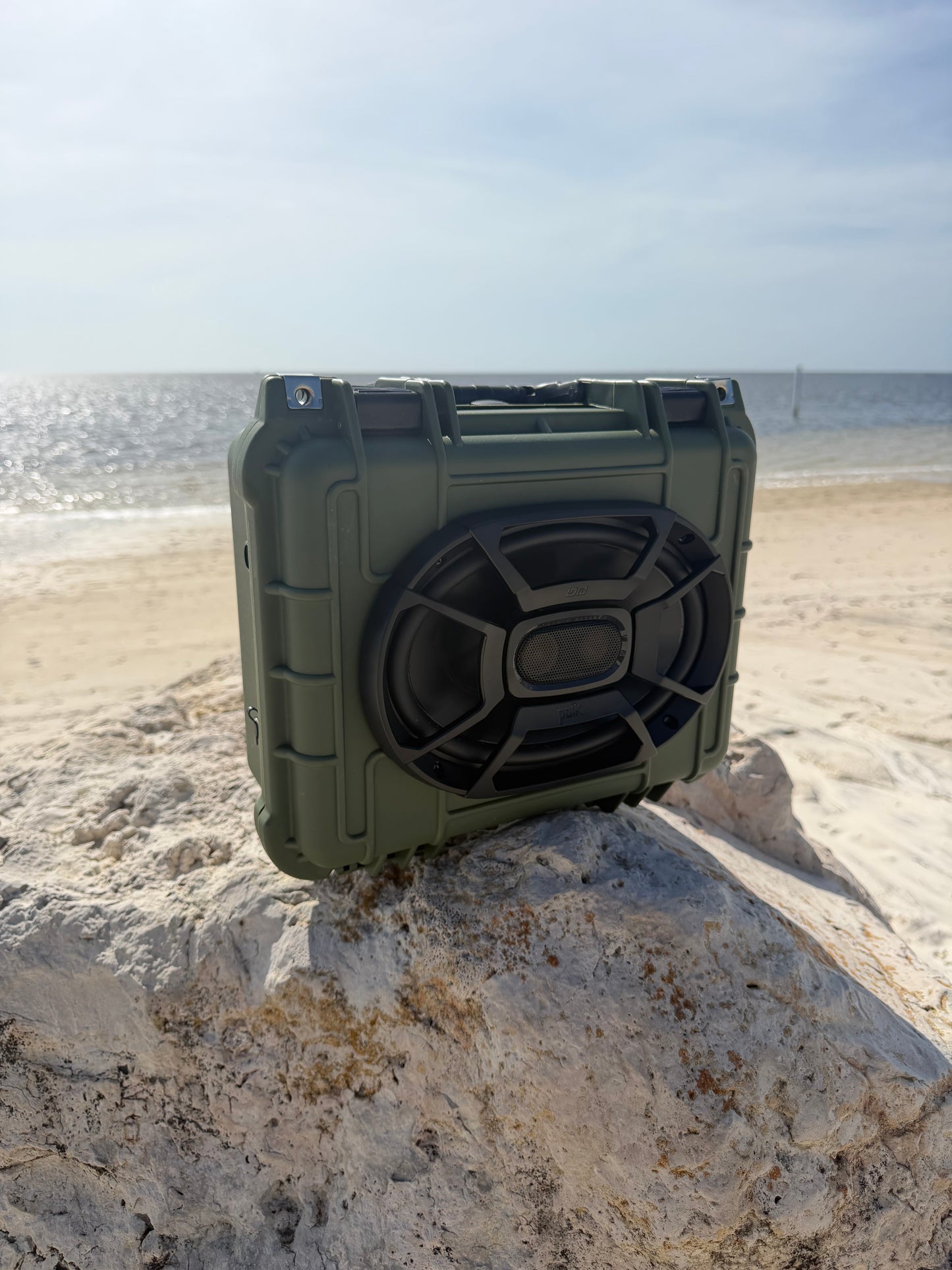 BB Forged OD Green rugged Bluetooth speaker on beach