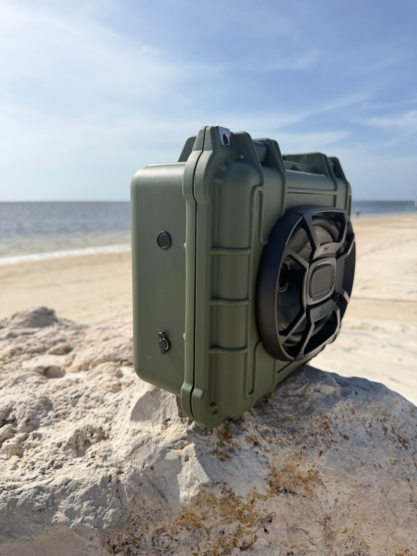 Bluetooth Speaker on Rock by the ocean 